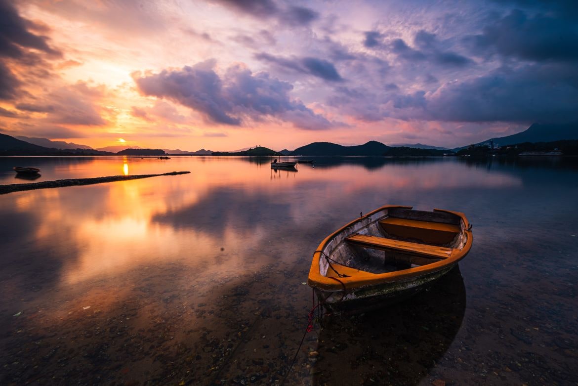 lake with wooden rowboat